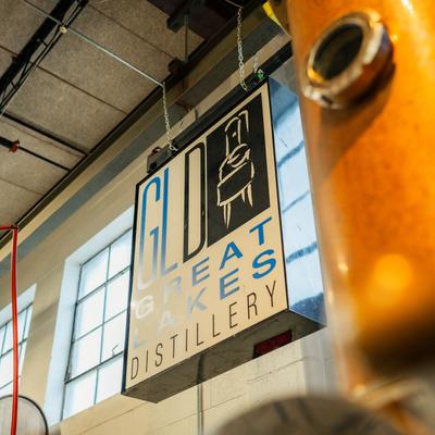Great Lakes Distillery hanging sign inside.