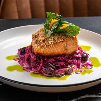 Pan-roasted salmon served over creamy red cabbage with kalamata olives.