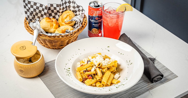 Pasta Bravissimo served with drink and bread rolls