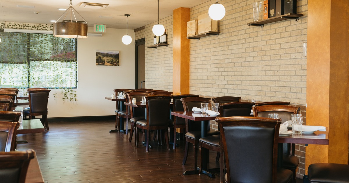 Interior, dining area with one white brick wall