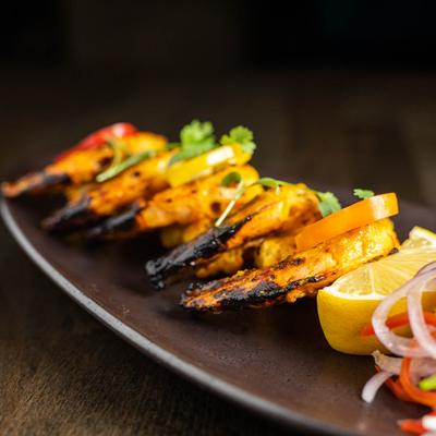 Prawns grilled in traditional Tandoor oven