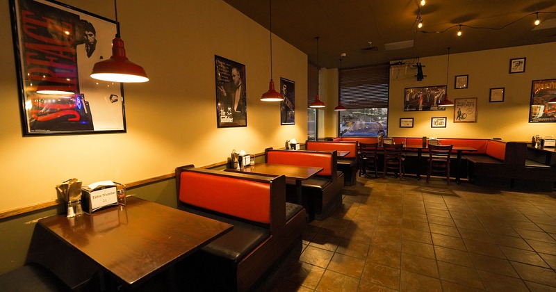 Interior, booths, upholstered benches, tables, lights, windows, wall decorations