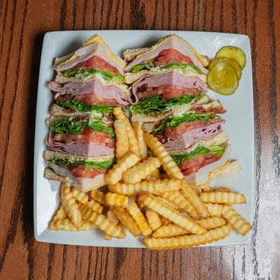 Triple Decker Club served with crinkle cut fries.