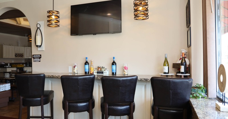 Bar stools, TV on the wall