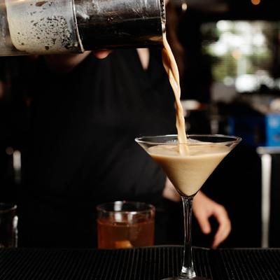 Bartender pouring an Espresso Martini.