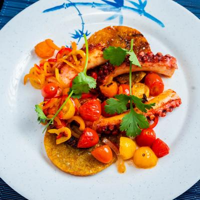 Octopus on green fried plantains.