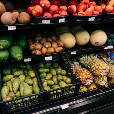 A grocery store display featuring a variety of fresh produce.