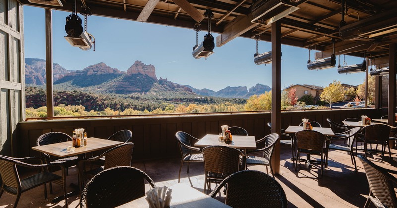 Interior, tables, chairs, lighting, a wide view of the mountains and the prairie