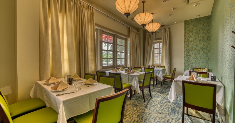 Cozy private dining room with set dining tables