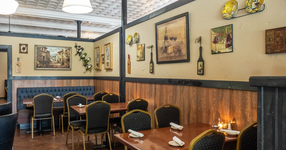 Interior, tables ready for guests, pictures on the wall