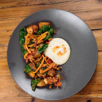 Spanish Grilled Octopus on a gray plate.