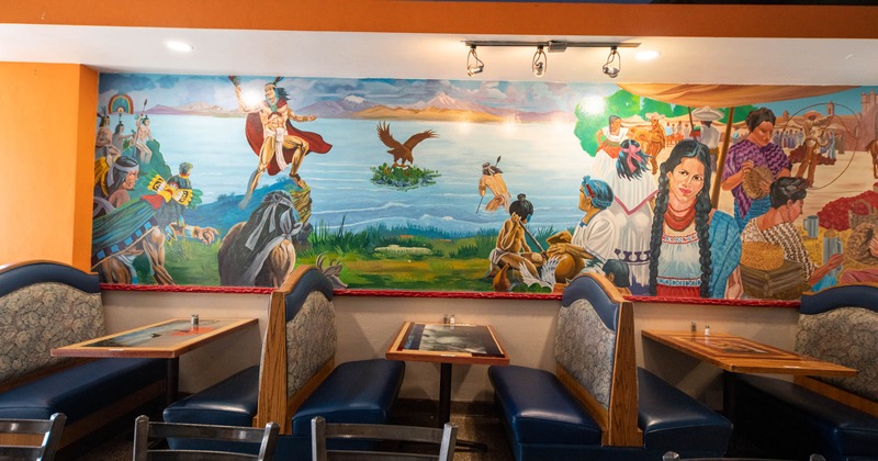 Booth area, mural on the wall