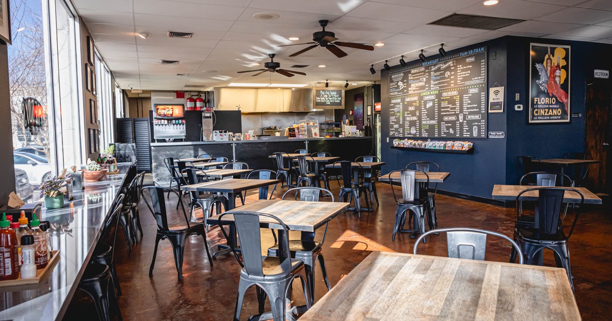 Interior, dining area and checkout counter in the back