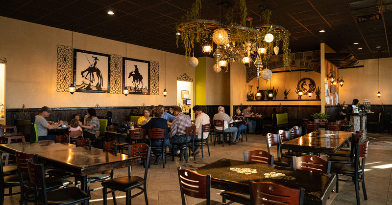 Interior, guests enjoying food and drinks