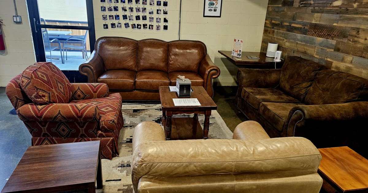 Lounge are with couches, comfy chairs, coffee table and side tables