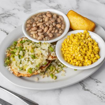 Smothered Chicken with corn, cornbread and pinto beans.