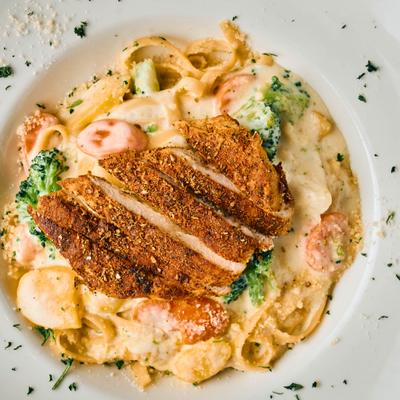 Blackened chicken pasta in a creamy sauce.