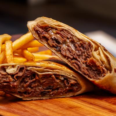 Meat-filled pastry with fries.
