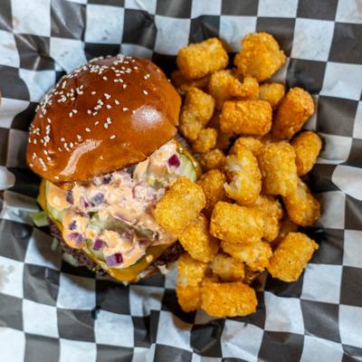 Golden Arch burger with tater tots on the side.