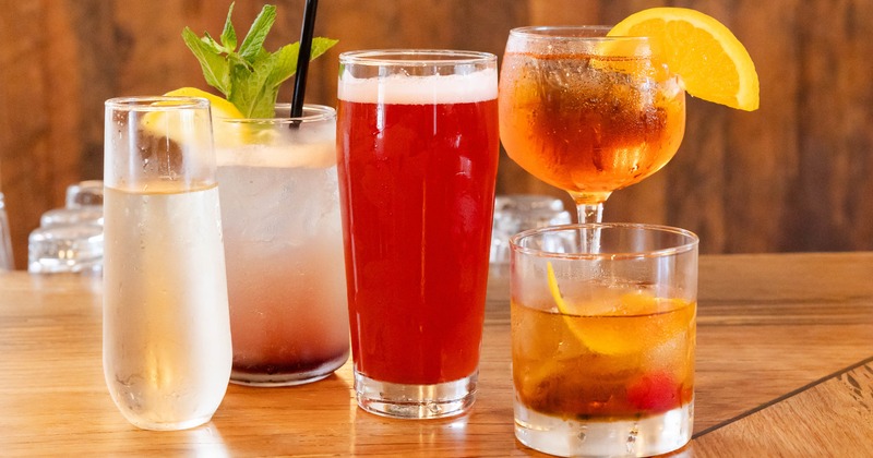 Assorted drinks on a wooden bar counter