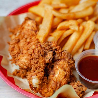 Chicken tenders with fries and sauce