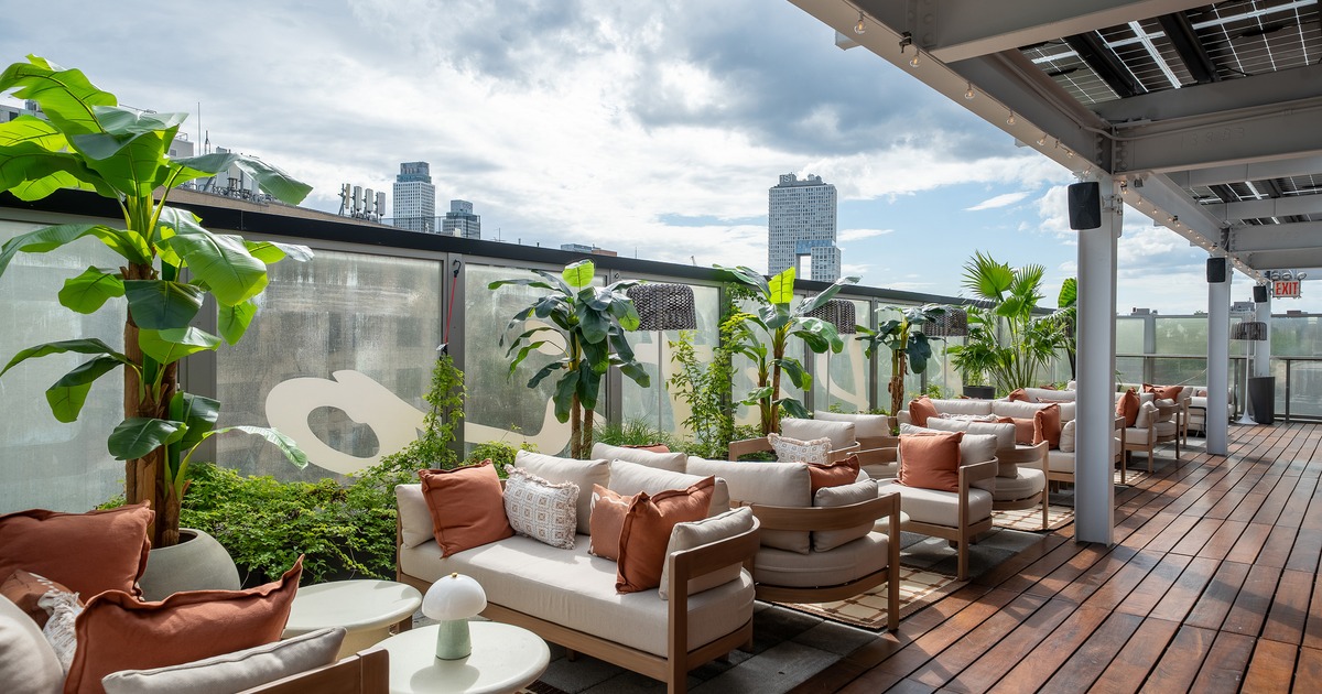 Modern and cozy rooftop lounge and outdoor seating area
