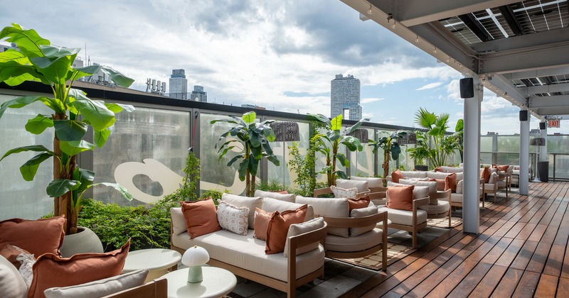 Modern and cozy rooftop lounge and outdoor seating area