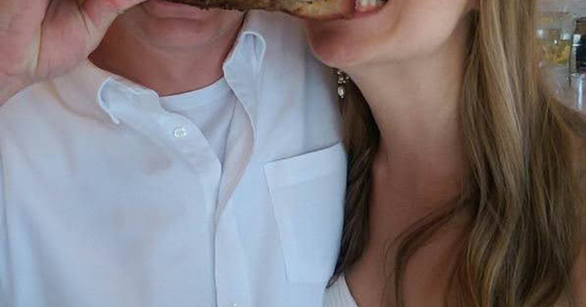 Bride and Groom enjoying a pork rib together.