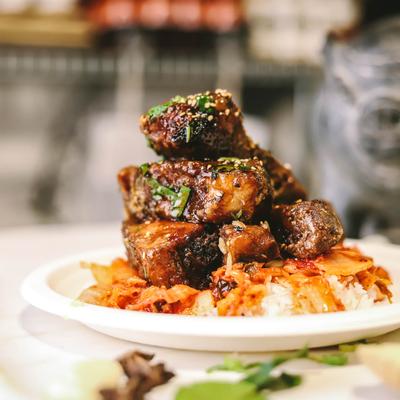 Pork belly burnt ends on rice.