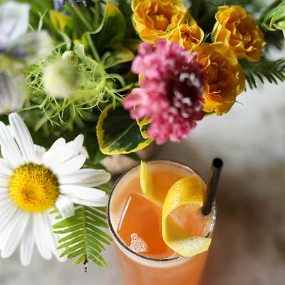 Cocktail in floral decor, top view