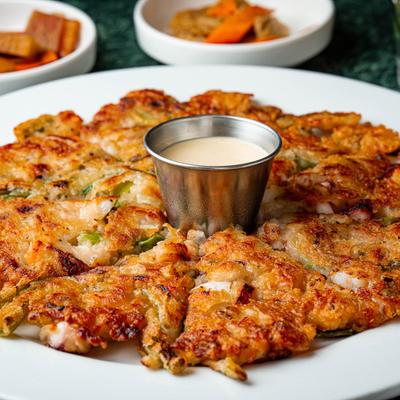 Seafood Pancake served with a dipping sauce.