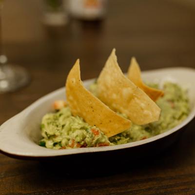 Guacamole topped with tortilla chips.