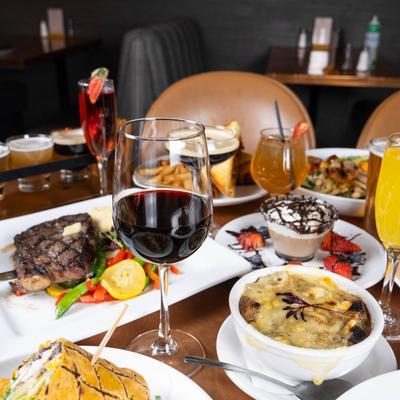 A variety of dishes and drinks on a table.
