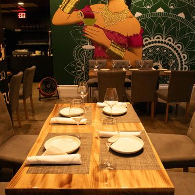 Interior, dining area, fully set tables.