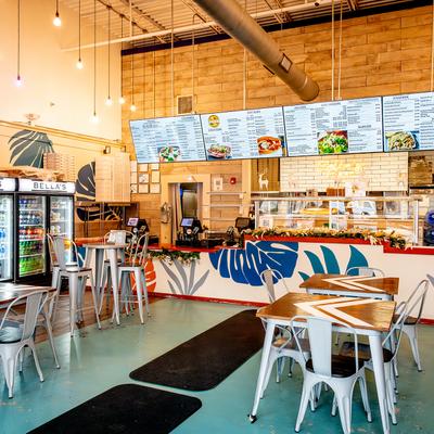 Restaurant interior, seating area, order counter.