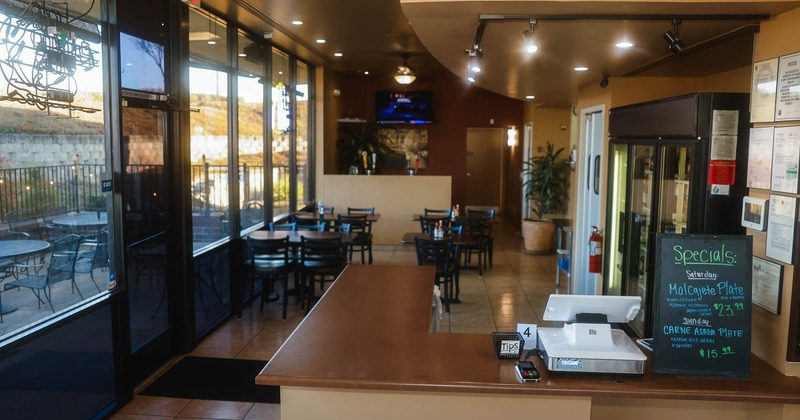 Interior, dining area with entrance on the left and counter on the right