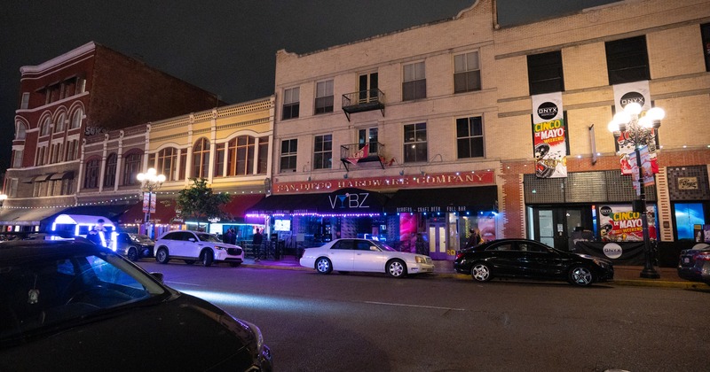Exterior, night, view to the club over street