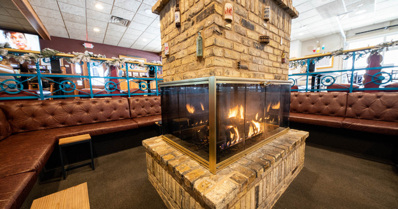 Interior, the seating area with the fireplace in the middle