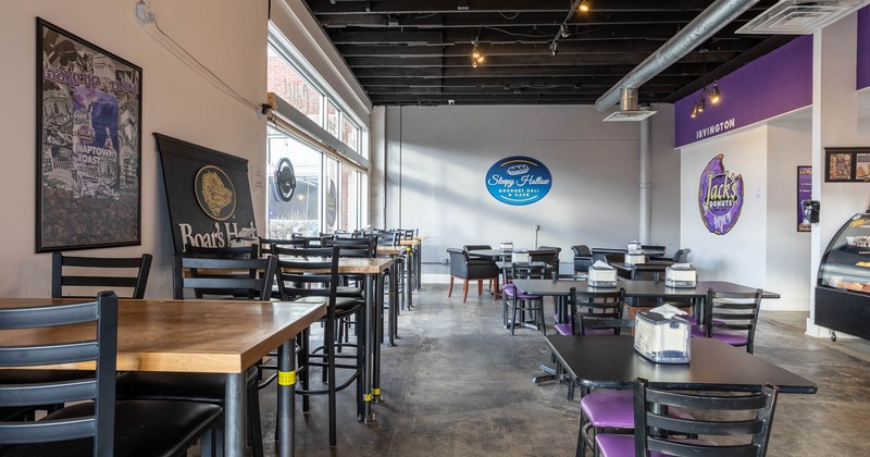 Interior, tall tables and bar stools, chairs and tables