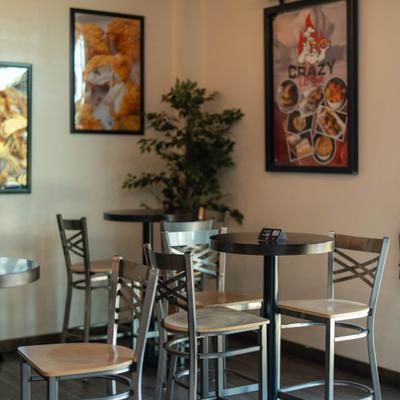 Interior, high seating area, tables for two.