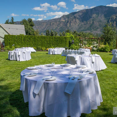 Restaurant grass area, tables ready for celebration