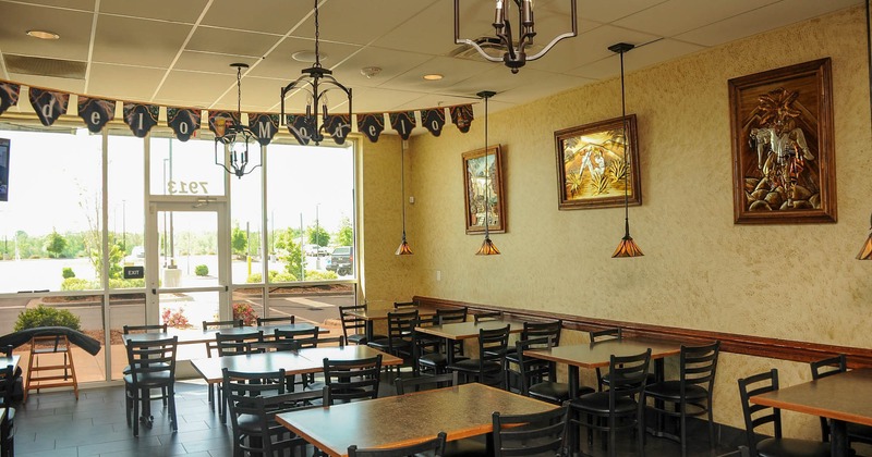 Interior, empty dining tables and chairs