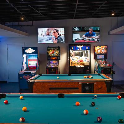 Game room, billiard table and pinball machines