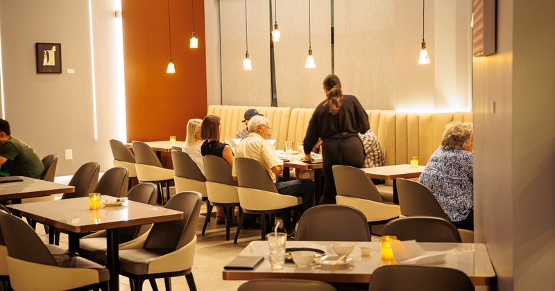Diner area, tables, chairs, people