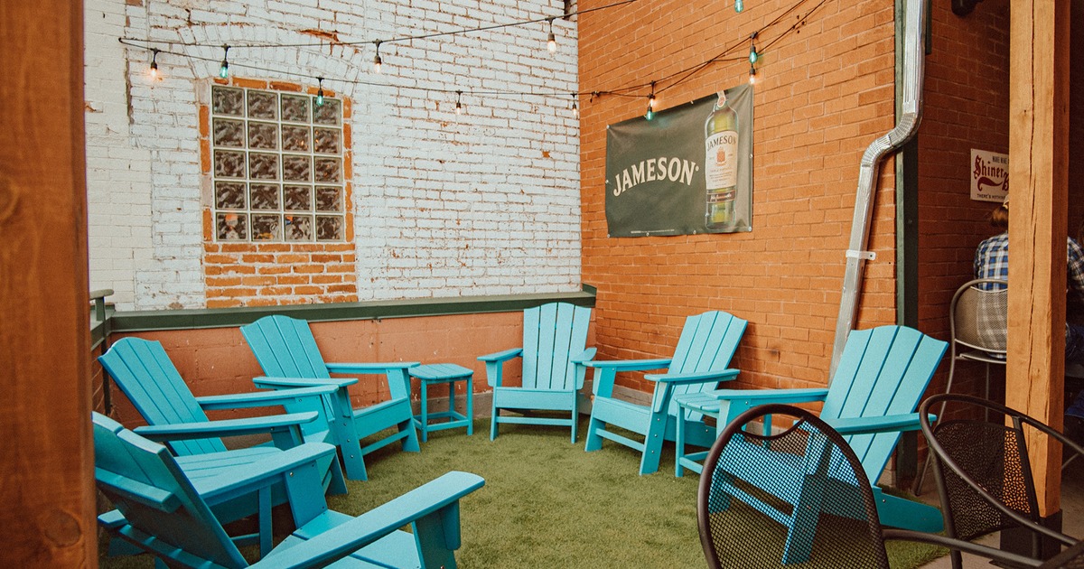 Rooftop patio, seating area with Adirondack blue wooden chairs