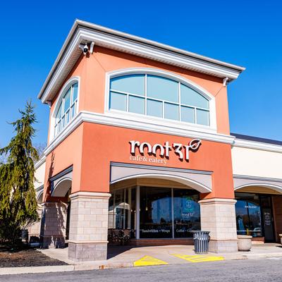 Exterior with signage against a clear blue sky.