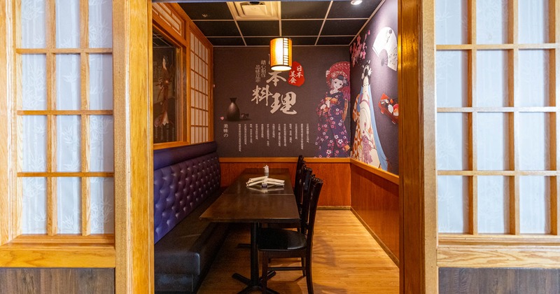 Interior, a room with button tufted seating tables and chairs by a wall, wall decorations