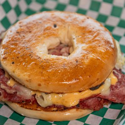 Reuben sandwich on a toasted bagel.