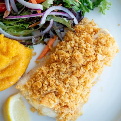 Baked Native Haddock  with mashed sweet potatoes and a side salad.