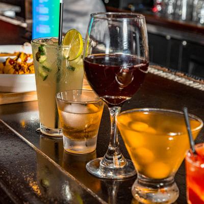 Different cocktails and wine served on the bar.